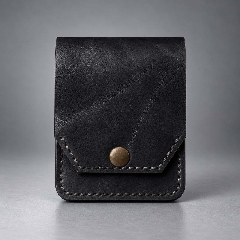Black compact leather snap pocket wallet front view with stitched flap