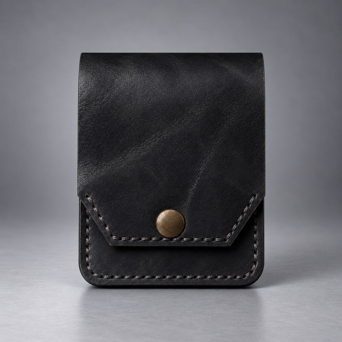 Black compact leather snap pocket wallet front view with stitched flap