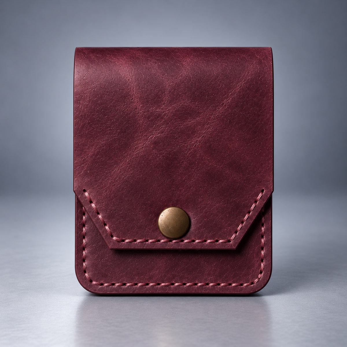 Burgundy compact leather snap pocket wallet front view