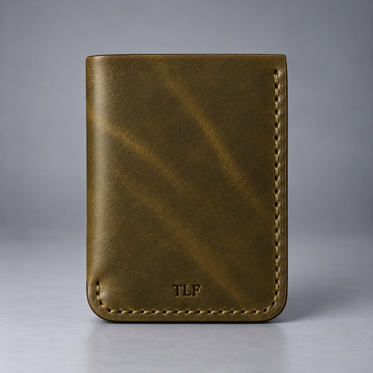 Back view of olive green leather pocket wallet with TLF mark