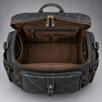Open midnight blue leather backpack duffle showing spacious interior and organiser pockets