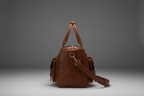 Cognac brown handmade genuine leather travel duffel bag side view | The Leather Factory
