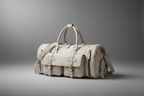 White cow print handmade genuine leather travel duffel bag front view | The Leather Factory