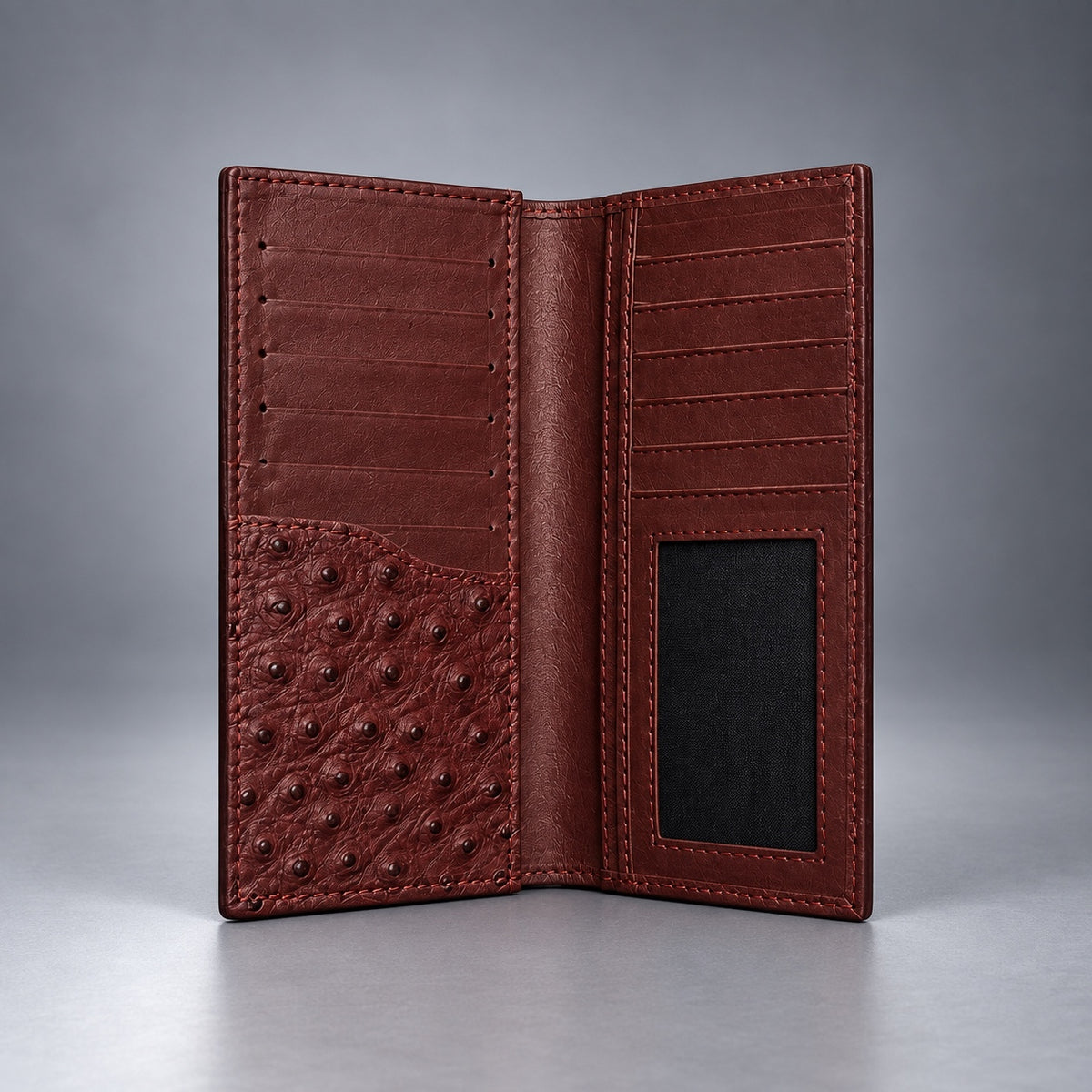Burgundy ostrich leather travel wallet front view with raised quill texture