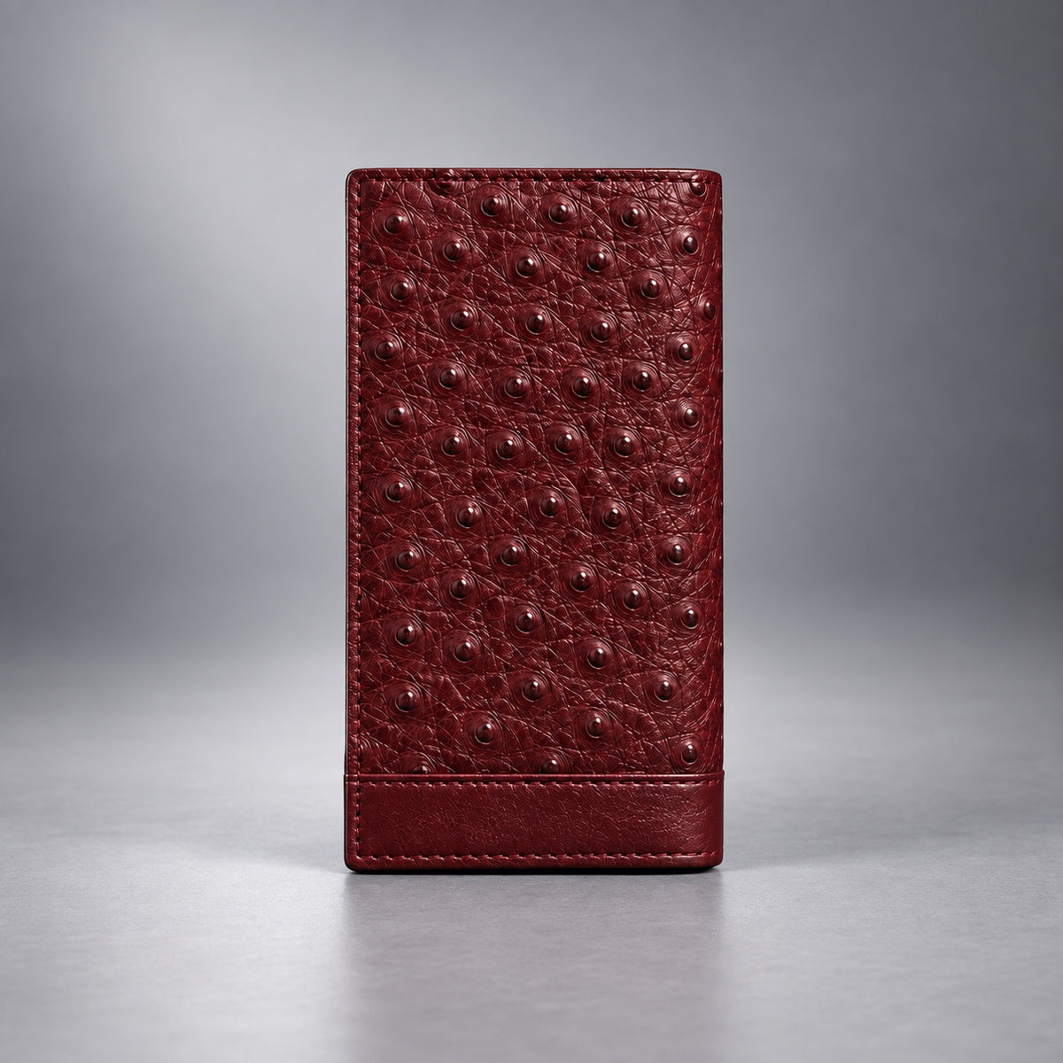 Open burgundy ostrich leather travel wallet with card slots and ID window