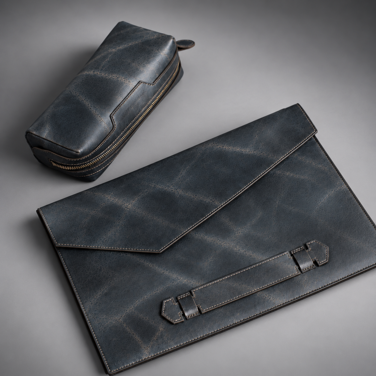 Midnight blue leather laptop sleeve and matching zippered accessory pouch