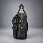 Side view of midnight blue leather laptop briefcase with side pockets and shoulder strap ring