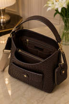 Interior of woven leather shoulder bag with zipper compartments | The Leather Factory