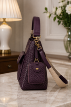 Side view of plum woven leather shoulder bag | The Leather Factory