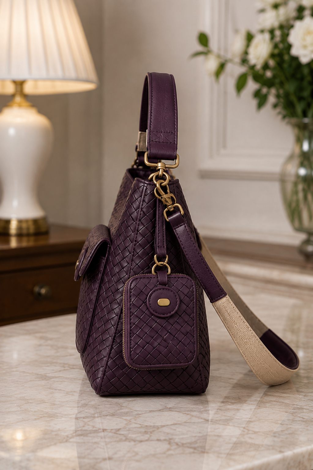Plum woven leather shoulder bag side view | The Leather Factory