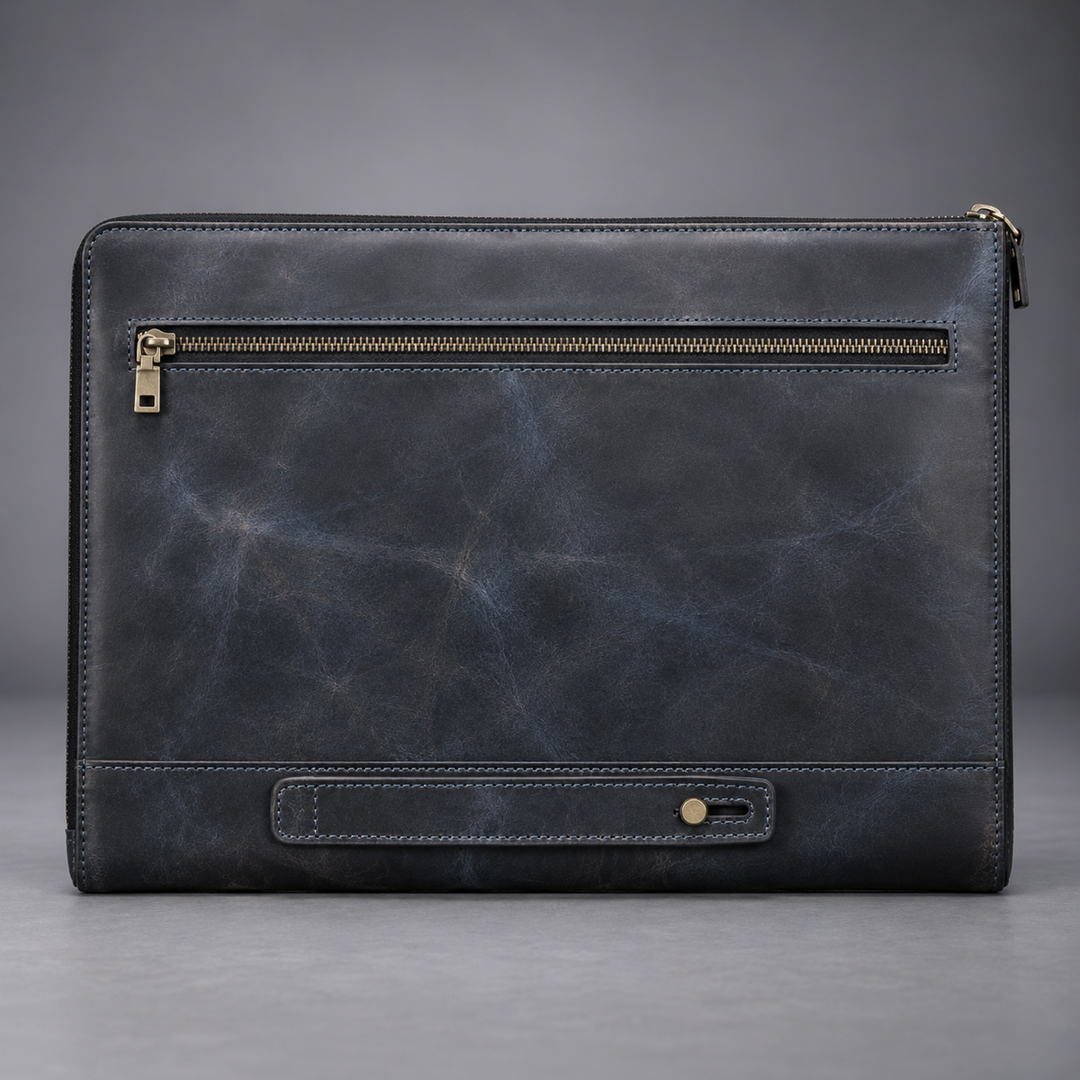 Back view of midnight blue leather laptop portfolio with zip pocket